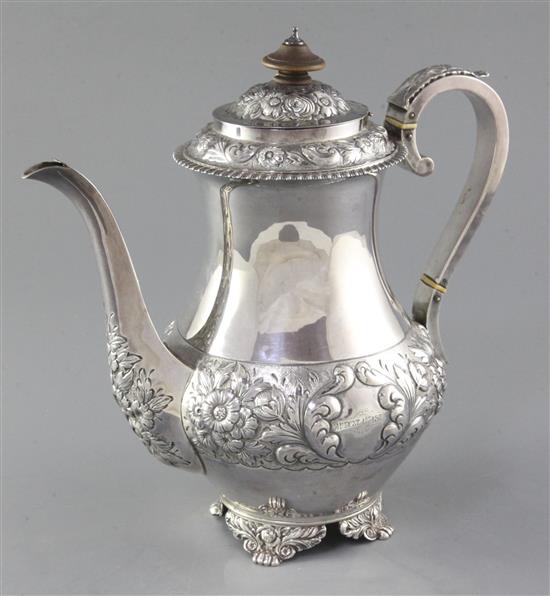 A Victorian embossed silver baluster coffee pot by Charles Stuart Harris, gross 27.6oz.